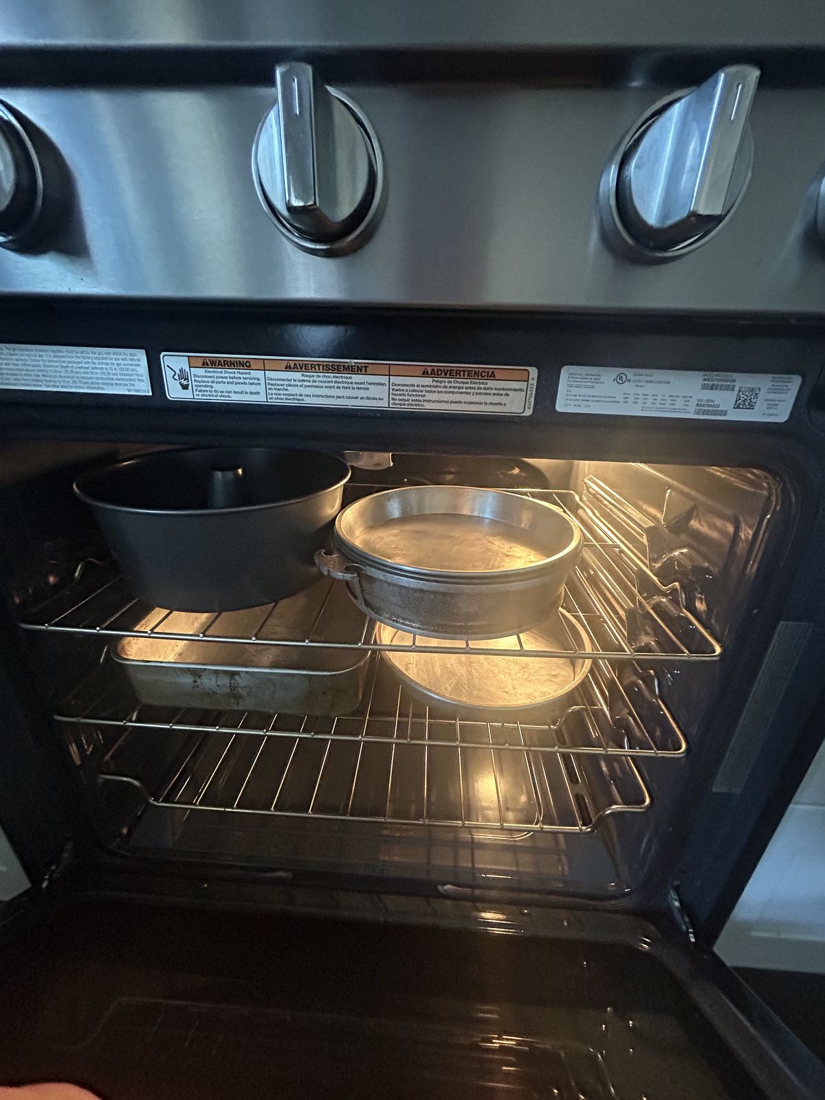 Gas range oven with bakeware inside during a heating check — oven and range repair call in Poulsbo, WA