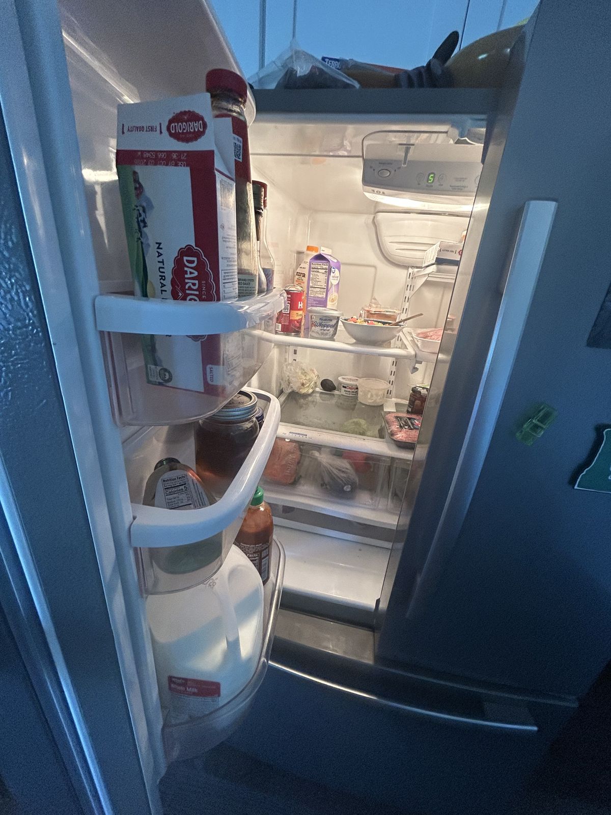 Open refrigerator during a diagnosis visit — refrigerator repair call in Bremerton, WA