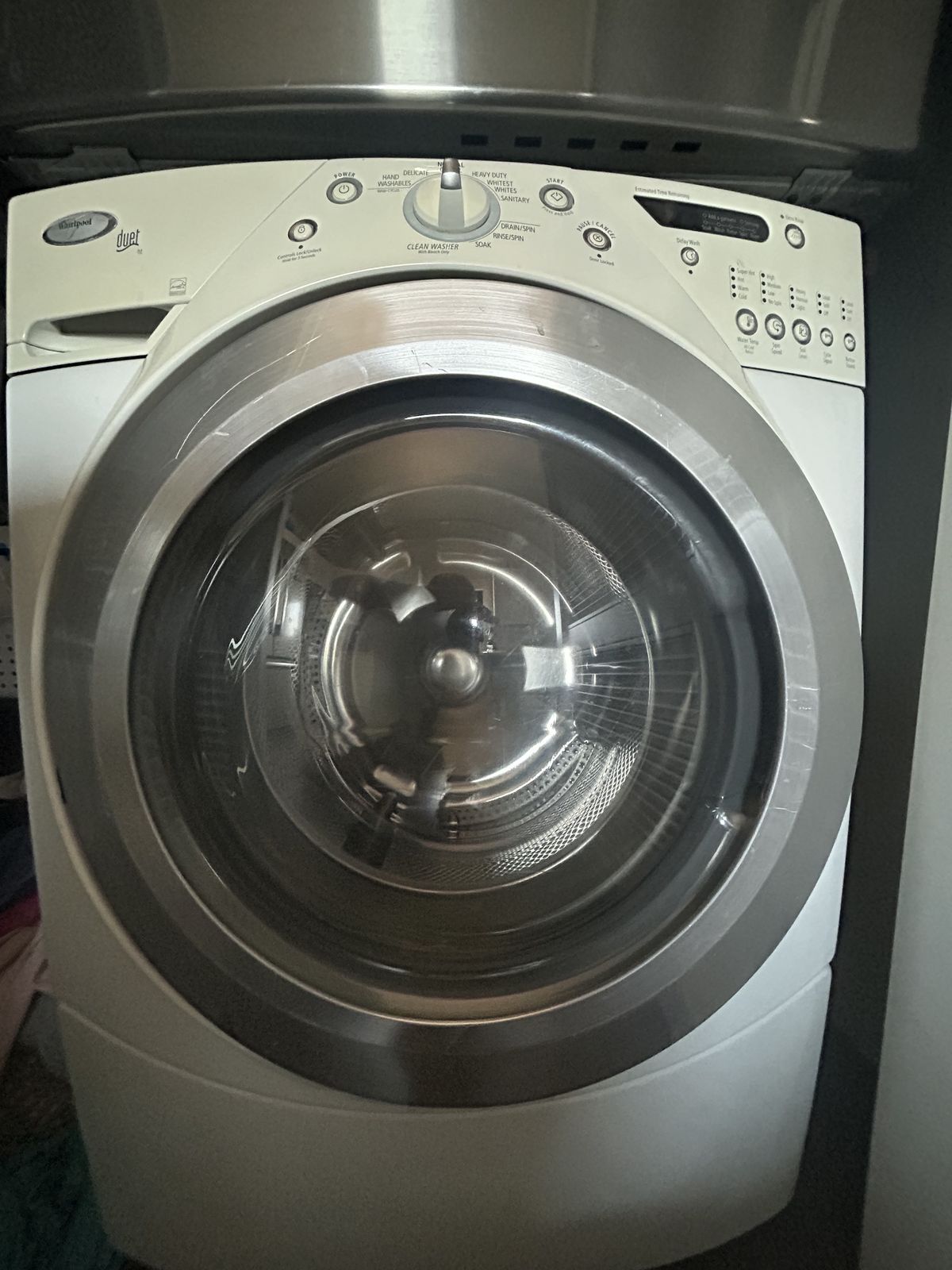 Front-load washer with the door closed before service — washer repair call in Gig Harbor, WA